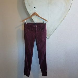 Wine colored skinny moto jeans